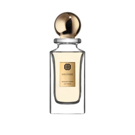 Perfume bottle with gold cap and label on a white background